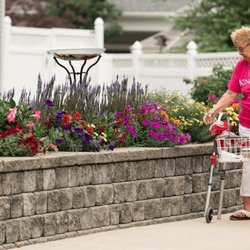 Kingston Care Center of Sylvania - Kingston Care Center of Sylvania Resident Enjoying the Courtyard