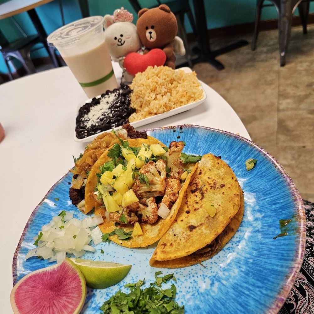 El Azul Taqueria - Three taco plate comes with beans and rice. We also got a horchata - Tacos Near Me - Honolulu, Hawaii