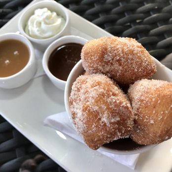Two Sisters Vineyards - Beignets with Carmel and Chocolate Sauces. Whipped Cream tops it off. Yum. - Wine Tours Near Me - Niagara-on-the-Lake, Ontario