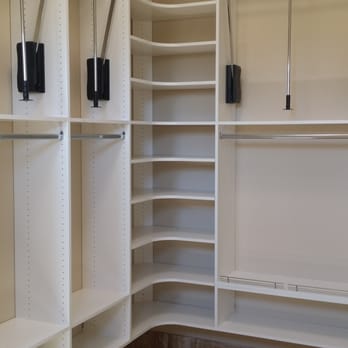 American Interiors - a walk - in closet with white shelvings - Flooring Near Me - Mesa, Arizona