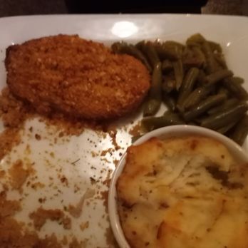 The Living Room Venice - I had the baked pork chops and loaded mashed potatoes.  I ate the 1st one already.   I highly recommend this place - American Near Me - Venice, Florida