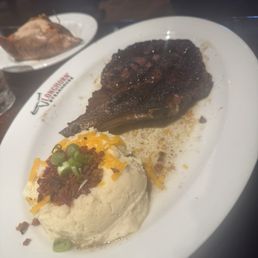 Medium well steak and loaded mashed potato Medium well steak and loaded mashed potato
