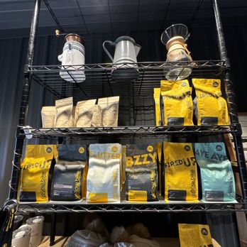 Yellow Bike Coffee - a shelf of coffee and coffee bags - Coffee & Tea Near Me - Duluth , Minnesota