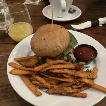 Taproot Lounge & Cafe - Mimosa + chicken breast mushroom swiss burger + sweet potato fries on side - Lounges Near Me - Salem, Oregon