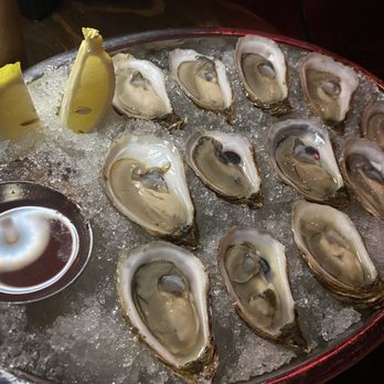 Bootlegger Cocktail Bar & Cuisine - $1 oysters and jalapeño sauce - Cocktail Bars Near Me - Montreal, Quebec
