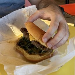 Unmelted American cheese on the Big John Burger with Cheese. Unmelted American cheese on the Big John Burger with Cheese.