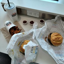 a burger and fries on a table