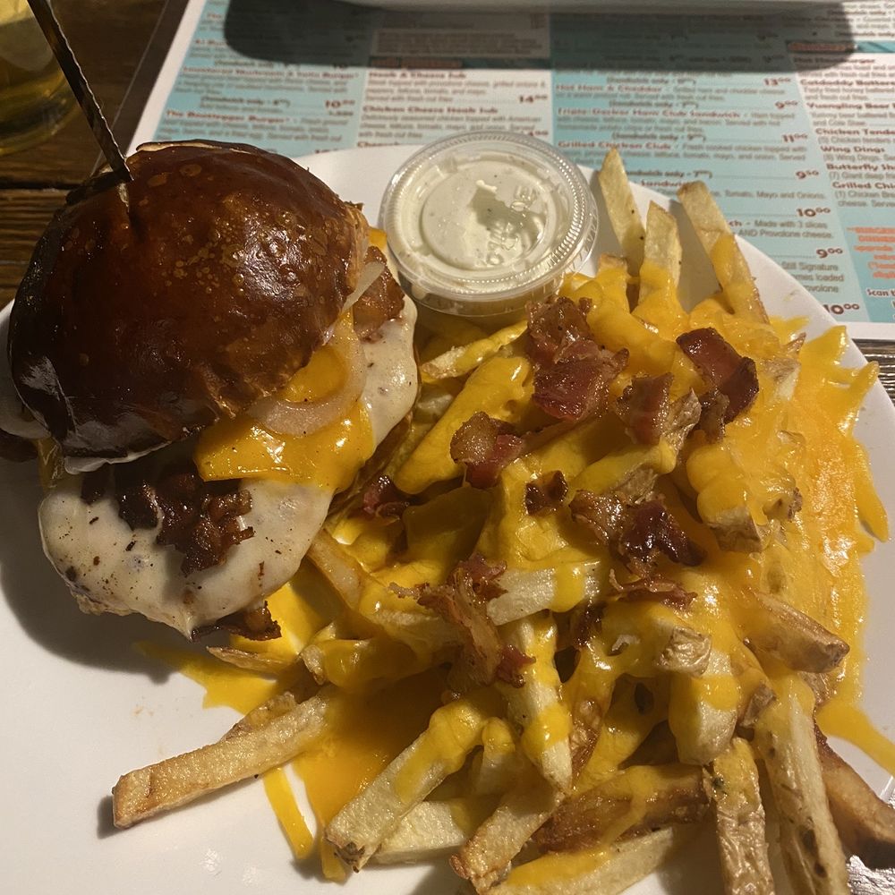 The Copper Still Pub - Smothered Mother Clucker Chicken sandwich with cheese fries. My go to dinner! - New American Near Me - Martinsburg, West Virginia The Copper Still Pub - Smothered Mother Clucker Chicken sandwich with cheese fries. My go to dinner! - New American Near Me - Martinsburg, West Virginia