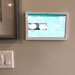 Samsung SMT500, running Home Assistant, powered by AC DC converter installed behind light switch receptacle. Low voltage wiring to tablet.
