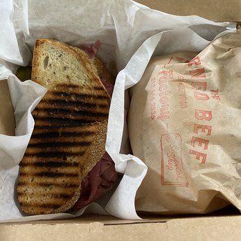 The Corned Beef Factory - Reuben (bag of homemade chips on the right) - Sandwiches Near Me - West Chicago, Illinois