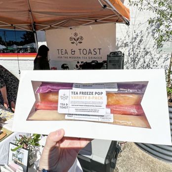 Tea & Toast Shop - a person holding a box of hotdogs - Coffee & Tea Near Me - Winston-Salem, North Carolina Tea & Toast Shop - a person holding a box of hotdogs - Coffee & Tea Near Me - Winston-Salem, North Carolina