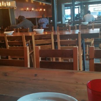 The Eagle Mass Ave - Communal seating at Farm Style Tables - American Near Me - Indianapolis, Indiana