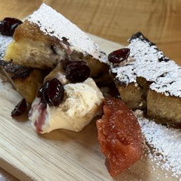 Griddled Bread Pudding with quince compote, orange infused cranberries and syrup, with fresh whipped cream. Griddled Bread Pudding with quince compote, orange infused cranberries and syrup, with fresh whipped cream.