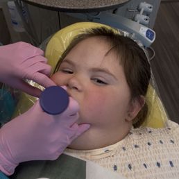 Getting her teeth cleaned