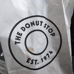 the donut shop logo on a paper bag
