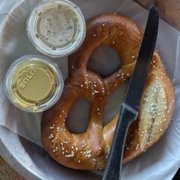 Large salted pretzel served with butter and spicy dijon Large salted pretzel served with butter and spicy dijon