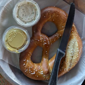 Watershed - Large salted pretzel served with butter and spicy dijon - German Near Me - Houston, Texas Watershed - Large salted pretzel served with butter and spicy dijon - German Near Me - Houston, Texas