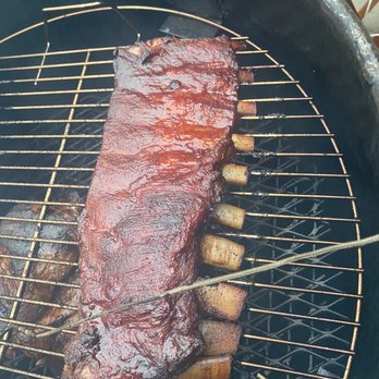 Food4Less - a rack of ribs cooking on a grill - Grocery Near Me - El Monte, California