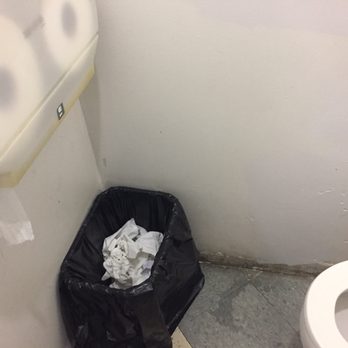 23 Mart - a toilet and trash can in a bathroom - Convenience Stores Near Me - Columbus, Ohio