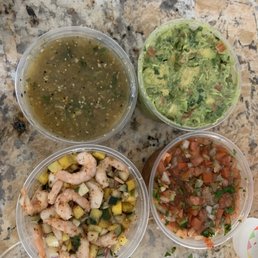 Items from Robert's market. Guacamole, shrimp ceviche, pico degallo salsa and green salsa Items from Robert's market. Guacamole, shrimp ceviche, pico degallo salsa and green salsa