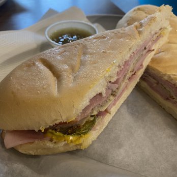 Cuban American Cafe - Cuban with a side of green "monkey" sauce. Get the sauce! - Cuban Near Me - Orlando, Florida Cuban American Cafe - Cuban with a side of green "monkey" sauce. Get the sauce! - Cuban Near Me - Orlando, Florida