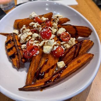 Outpost Neighborhood Tavern - Perfectly cooked loaded sweet potato fries - Southern Near Me - Orlando, Florida Outpost Neighborhood Tavern - Perfectly cooked loaded sweet potato fries - Southern Near Me - Orlando, Florida