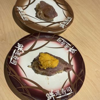 Waka Sakura - TOP: Seared wagyu beef with salt sauce.  BOTTOM: Seared Wagyu beef topped sea urchin with salt sauce. - Conveyor Belt Sushi Near Me - Gardena, California