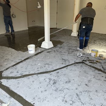 Angel's Paint & Epoxy - After grinding, applying primer - Flooring Near Me Angel's Paint & Epoxy - After grinding, applying primer - Flooring Near Me