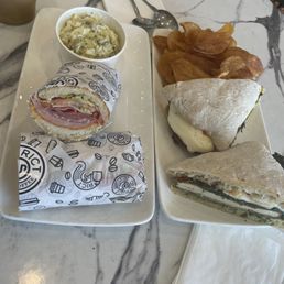 Italian Sandwich with potato salad and Chicken Cutlet Sandwich with chips