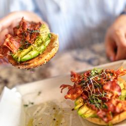 Kountry Kitchen - Avocado Bacon Bagel $16 "an everything bagel topped with pesto, avocado, bacon and microgreens"
