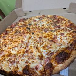 Regino's Pizza - Large pizza - half Canadian half Hawaiian.  Unfortunately it has less toppings & is more saltier than before