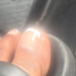 Solar Nails & Spa - polish on toes , sloppy