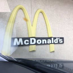 a mcdonald's logo on the side of a building a mcdonald's logo on the side of a building