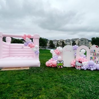 Rowdy Republic - Ballerina pink bounce house with backdrop set up for Hello Kitty party - Bounce House Rentals Near Me Rowdy Republic - Ballerina pink bounce house with backdrop set up for Hello Kitty party - Bounce House Rentals Near Me