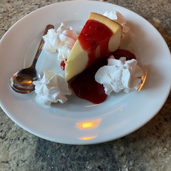 Benchmark Sports Pub & Eatery - Traditional Cheesecake with strawberry sauce - Sports Bars Near Me - Franklin, Tennessee Benchmark Sports Pub & Eatery - Traditional Cheesecake with strawberry sauce - Sports Bars Near Me - Franklin, Tennessee