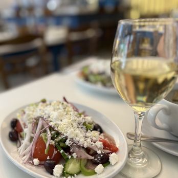 yasouvlaki - a plate of salad and a glass of wine - Greek Near Me - New York, New York yasouvlaki - a plate of salad and a glass of wine - Greek Near Me - New York, New York
