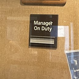"Manager on duty" plaque with empty name-slot for manager. "Manager on duty" plaque with empty name-slot for manager.