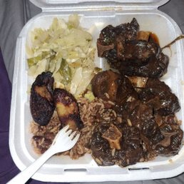 Large non flavor oxtails with cabbage and rice/ peas Large non flavor oxtails with cabbage and rice/ peas
