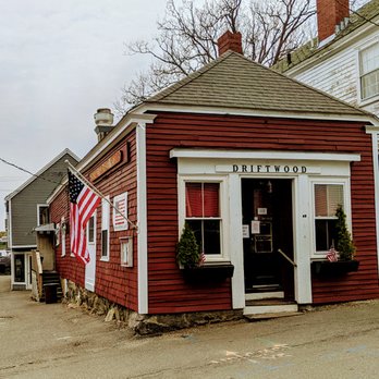 Driftwood - a small red building with a flag on the front door - American Near Me - Marblehead, Massachusetts