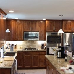 Maltas Construction - Complete kitchen remodel. New lighting,plumbing, floor plan change, new knotty alder cabinets, new tile floors