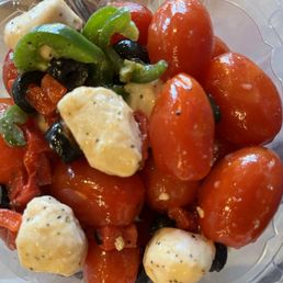 Caprese salad is so delicious with grape tomatoes, fresh mozzarella balls, sliced olives and jalapeños. Caprese salad is so delicious with grape tomatoes, fresh mozzarella balls, sliced olives and jalapeños.