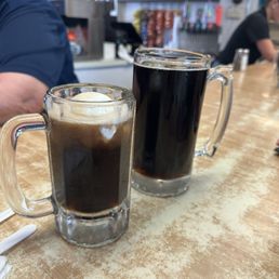 Small root beer float and large root beer Small root beer float and large root beer