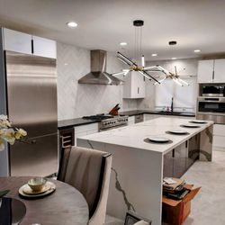 Mat-Su Carpentry and Construction - Kitchen remodel. Installed and modified cabinets for appliances, replaced dented refrigerator door, installed hanging light fixtures.