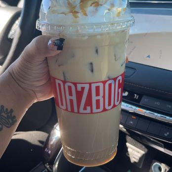 Dazbog Coffee - a hand holding a cup of coffee - Coffee & Tea Near Me - Denver, Colorado Dazbog Coffee - a hand holding a cup of coffee - Coffee & Tea Near Me - Denver, Colorado