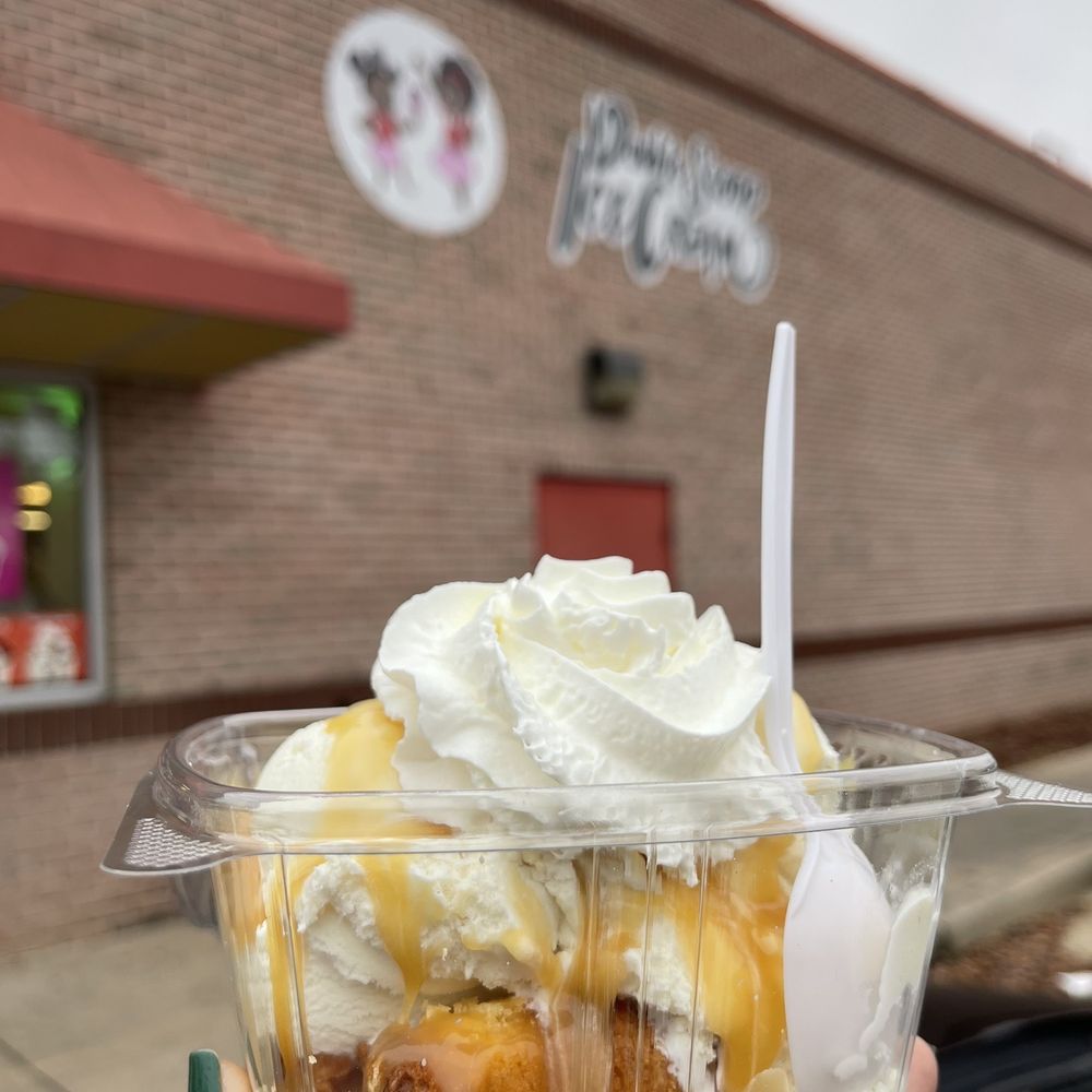 Double Scoop Ice Cream - a hand holding a container of ice cream - Ice Cream & Frozen Yogurt Near Me - Lithonia, Georgia