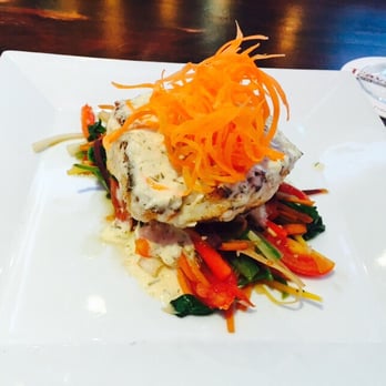 Travesias - Sea Bass with sautéed vegetables in a house sauce - Latin American Near Me - Bronx, New York Travesias - Sea Bass with sautéed vegetables in a house sauce - Latin American Near Me - Bronx, New York
