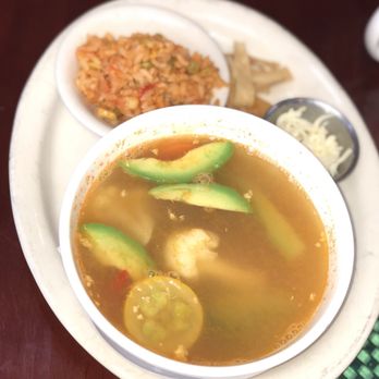 Sabor Cocina Mexicana - Delicious bowl of tortilla soup with a side of rice, cheese, and chips- broth based with fresh mixed vegetables and shredded chicken pieces - Mexican Near Me - San Antonio, Texas Sabor Cocina Mexicana - Delicious bowl of tortilla soup with a side of rice, cheese, and chips- broth based with fresh mixed vegetables and shredded chicken pieces - Mexican Near Me - San Antonio, Texas