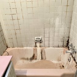 Making Life Easier - Before Shot of Bathtub filled with MOLD