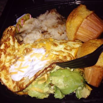 Ball Square Cafe - Mexican omelette  Avocado, Jalapeño Peppers, Tomatoes, Scallions, Cilantro, Cheese topped with Sour Cream w/ Grilled Corn Muffin - Breakfast & Brunch Near Me - Somerville, Massachusetts