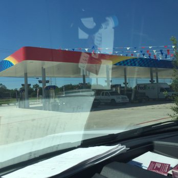 Stripes - the reflection of a man in a gas station - Gas Stations Near Me - Manvel, Texas
